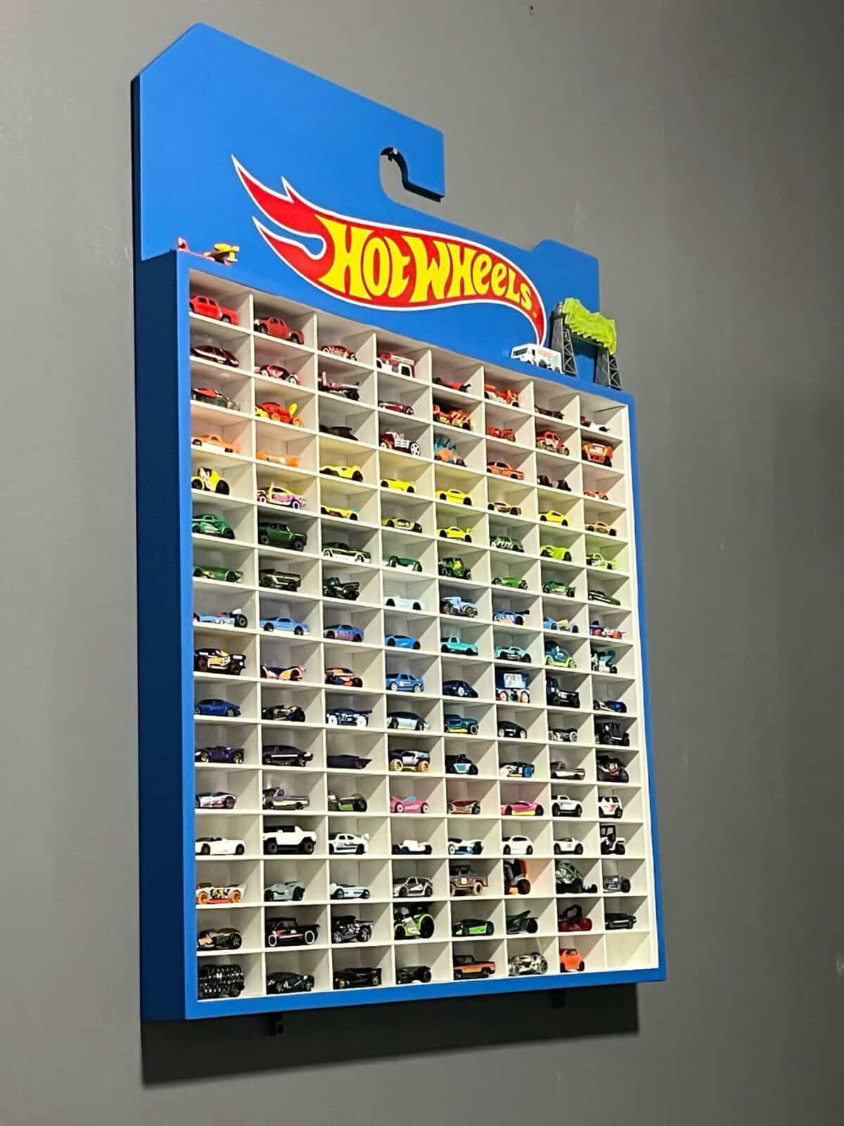 Hot Wheels display case with numerous model cars on a gray background